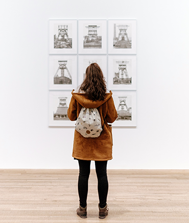 image of girl looking at art in museum